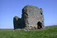 The remains of a lonely remote castle on the edge of the firth of clyde